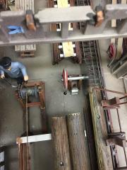 sawmill looking down on the main blade and log puller.JPG